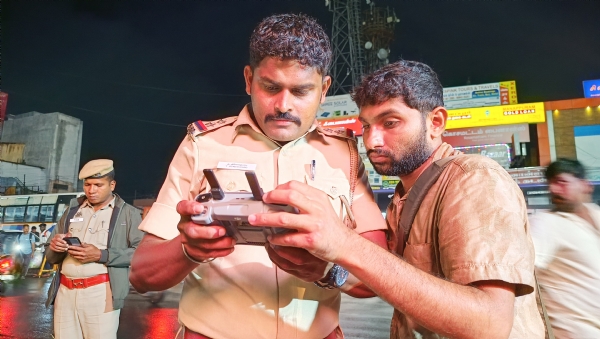 In Coimbatore, police officers are monitoring with drone cameras to prevent crimes occurring in the heavy crowds at bus stations—immediate action being taken!