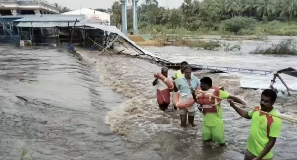 Two security guards who were trapped in the floods near the Palaar riverbank at the Anjaneyar Temple in Pollachi were rescued by the fire and rescue personnel after a long struggle.