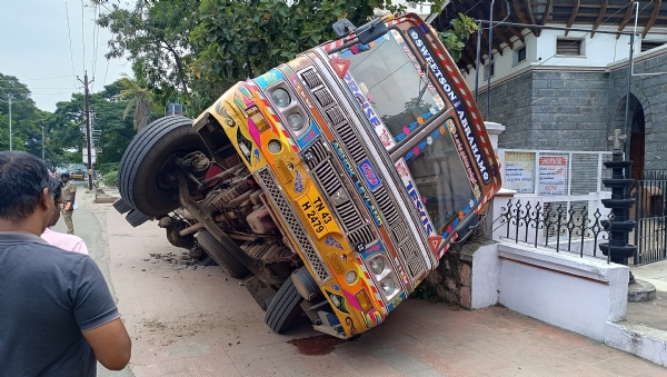 A lorry carrying a load of rice met with an accident after its wheel got stuck in a pit due to the heavy weight. A lorry carrying a load of rice met with an accident after its wheel got stuck in a pit due to the heavy weight.