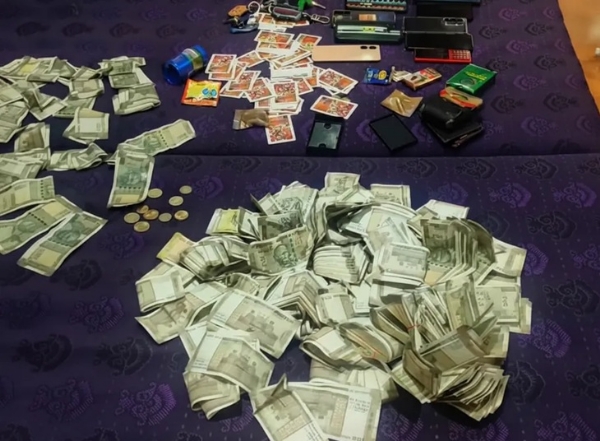 Gambling for money in a mango grove Gambling for money in a mango grove